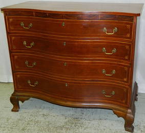 New England serpentine front inlaid cherry chest.