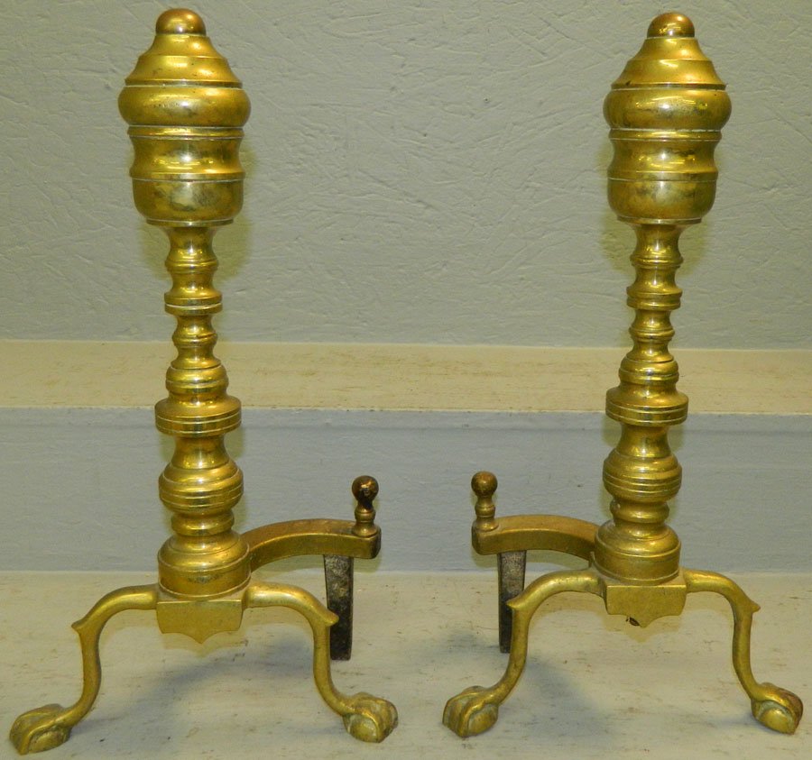 Pair of early brass andirons with claw feet.: Pair of early brass andirons with claw feet. 17 1/2" tall.