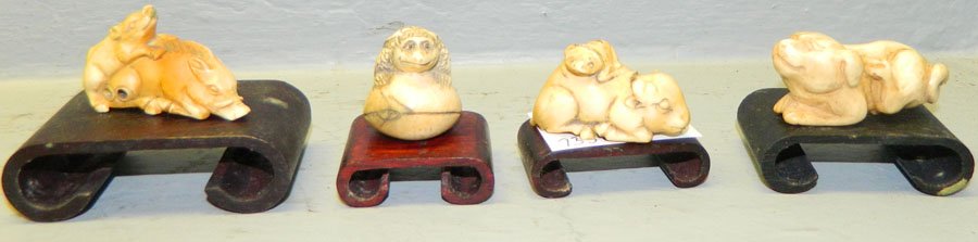 (4) Ivory netsukes.: (4) Ivory netsukes. One turtle on shell, pig on mother, dog and buffalo with baby. 1".