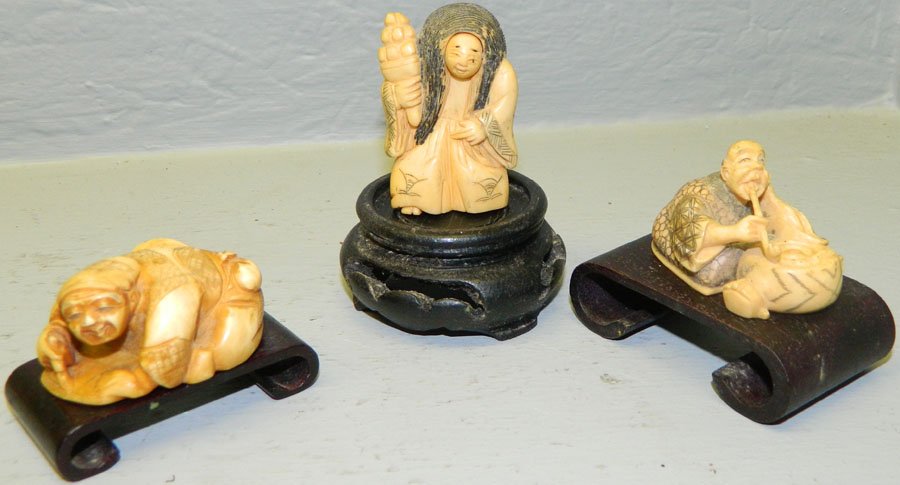 (3) Ivory netsukes.: (3) Ivory netsukes. One happy and sad face, one artist painting and a snake charmer. 2".