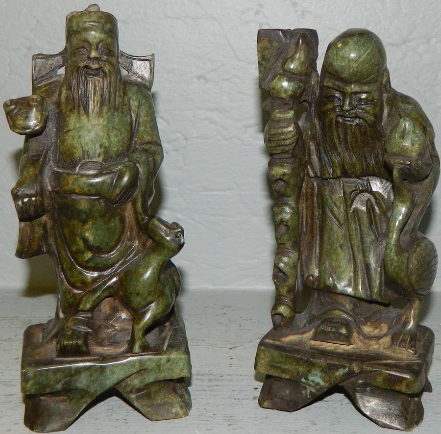 Pair of soapstone figures.: Pair of soapstone figures. There is a chip on the dogs ear. 7 1/4" and 8 1/2" tall.