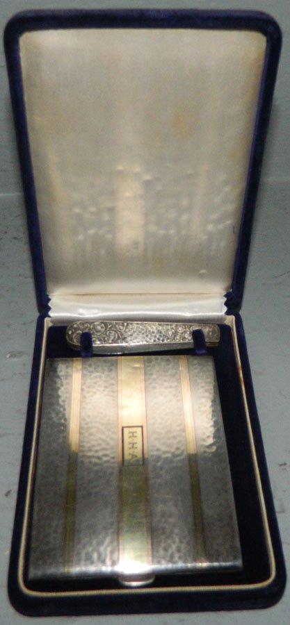Sterl. & 14K gold cig case & sterl. knife. 4.65 t.o.: Sterling and 14K gold cigarette case and a sterling knife. 4.65 troy ounces.