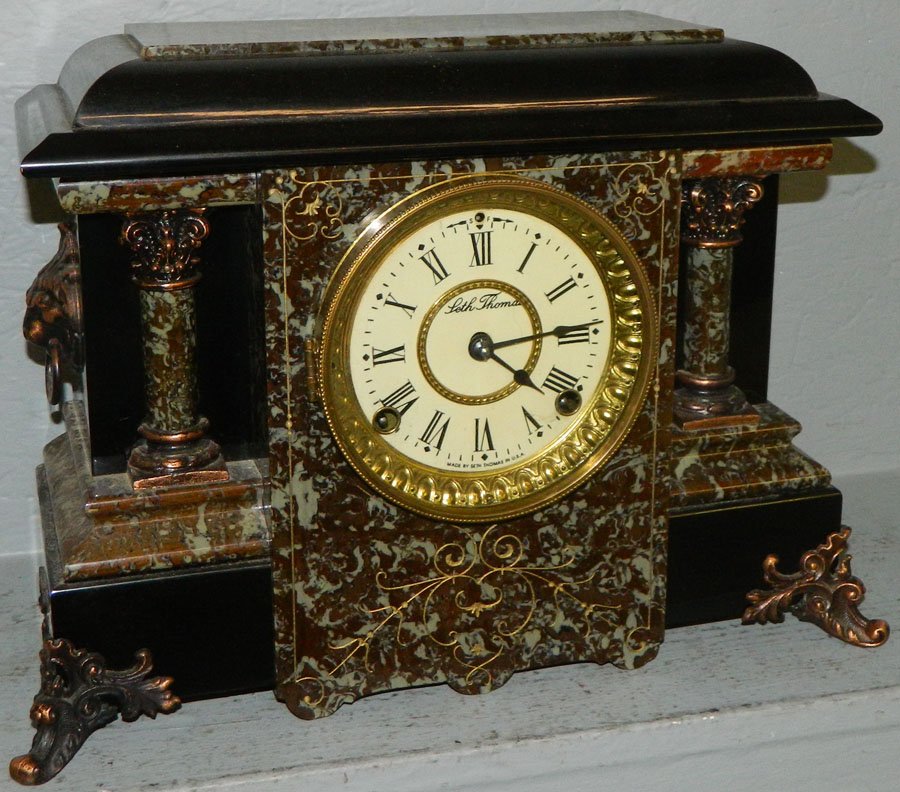Seth Thomas faux marble and onyx shelf clock.: Seth Thomas faux marble and onyx shelf clock from the Radford estate. 14" wide x 6" deep x 12" tall.