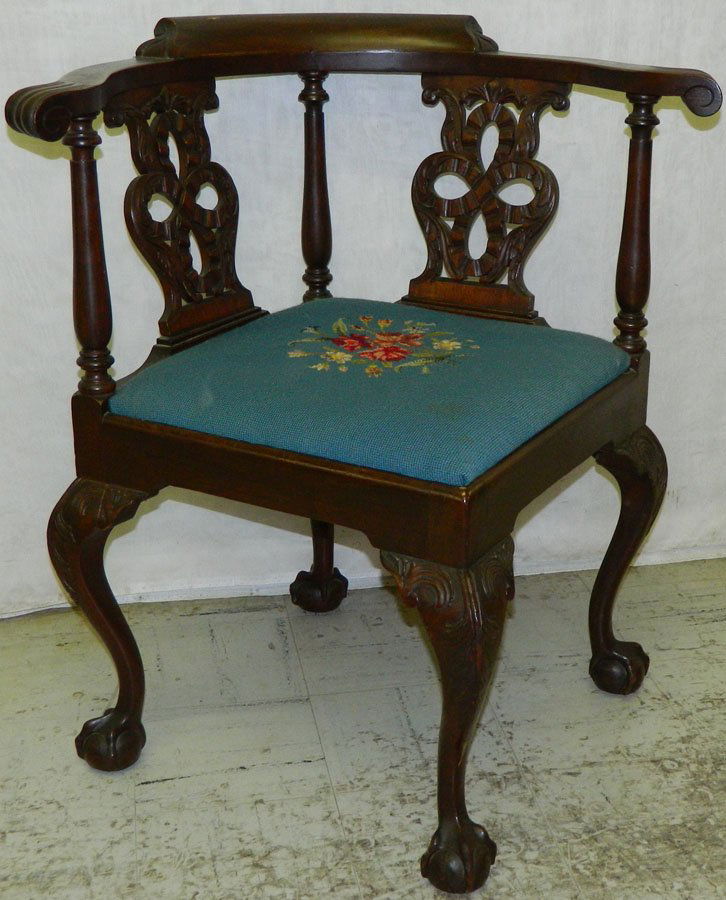 Mahogany ball and claw corner chair.: Mahogany ball and claw corner chair with needlepoint seat. 33" back.