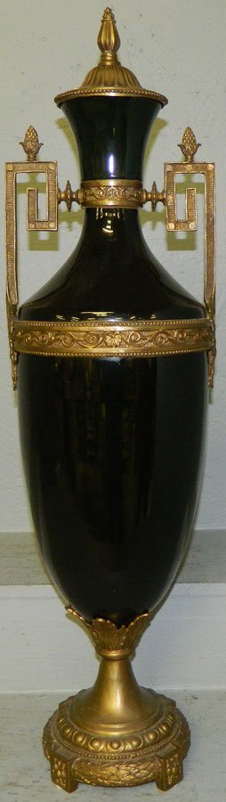 Black porcelain vase with ormolu trim.: Black porcelain vase with ormolu trim. 32" tall.