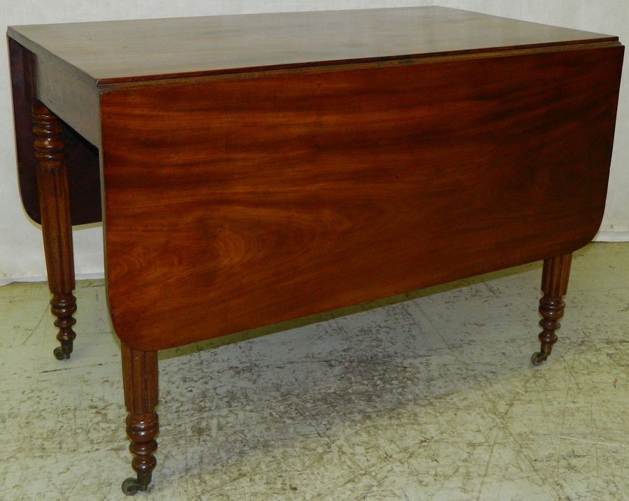 Mahogany drop leaf turn leg Sheraton table.: Mahogany drop leaf turn leg Sheraton table, circa 1820-1850. 57" open x 42" deep x 29" tall.