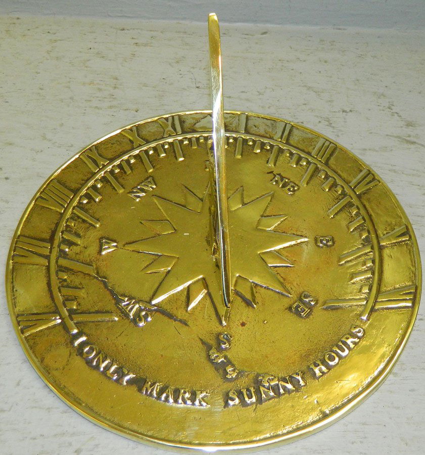 Brass sundial by Virginia Metalcrafters.: Brass sundial by Virginia Metalcrafters. 10" diameter.