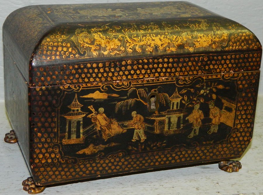 19th C papier mache and lacquered tea caddy.: 19th Century papier mache and lacquered tea caddy with original brass feet. 8" wide x 5" deep x 5 1/2" tall.