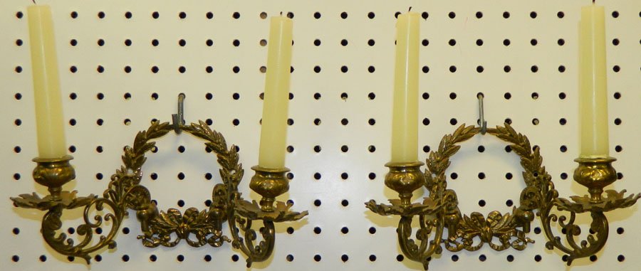 Pair of brass or bronze wall sconces.: Pair of brass or bronze wall sconces. 5" tall.