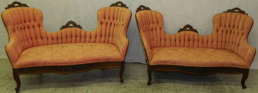 Pair of rosewood tufted back settees.: Pair of rosewood tufted back settees. 60" wide x 25" deep x 36" tall.