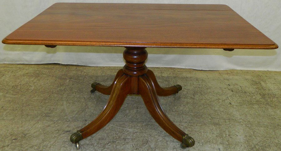 Pedestal mahogany breakfast table.: Pedestal mahogany breakfast table, circa 1820. 53" wide x 38 1/2" deep x 28 1/4" tall.