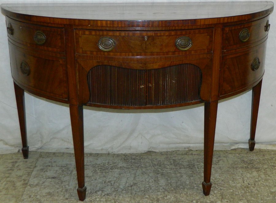 19th C HW mahogany demilune sideboard: 19th Century Hepplewhite mahogany demilune sideboard with tambour doors. 36 1/2" tall x 24 1/2" deep x 59" wide.