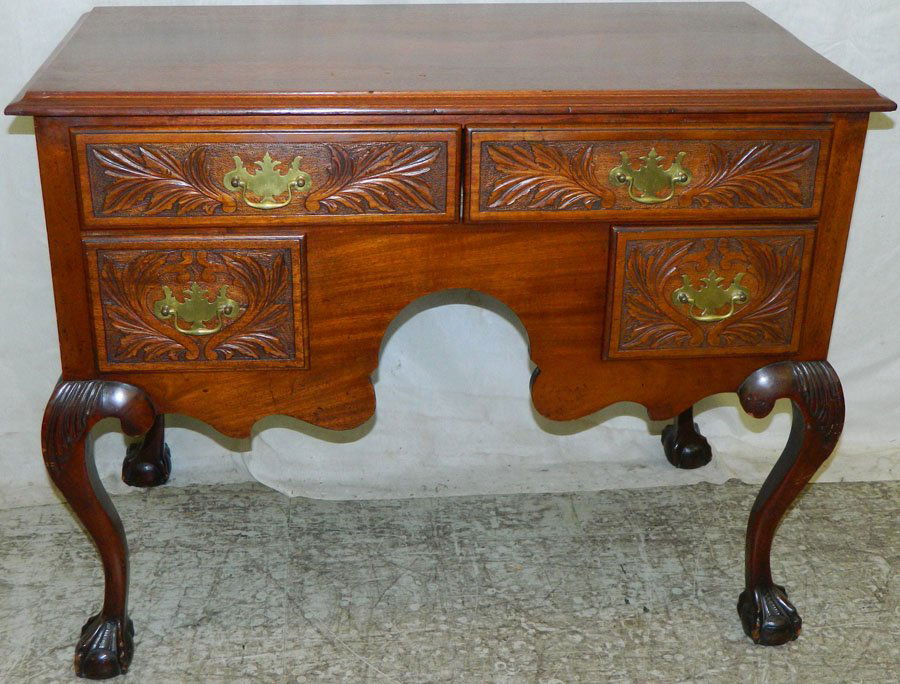 Turn of the century mah ball and claw lowboy.: Turn of the century mahogany ball and claw lowboy with carved front. 38 1/4" wide x 20" deep x 30 1/2" tall.