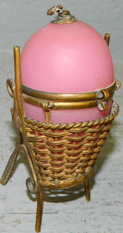 Pink alabaster jewelry box in basket. 4" tall.: Pink alabaster jewelry box in basket. 4" tall.