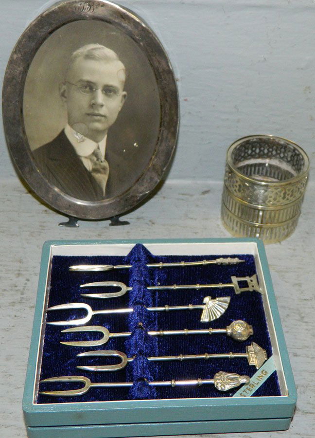 Sterling cocktail forks, frame & toothpick holder.: Six sterling cocktail forks, sterling frame and a sterling and glass toothpick holder. Forks 4" long, frame 5 3/4", toothpick holder 2" tall.