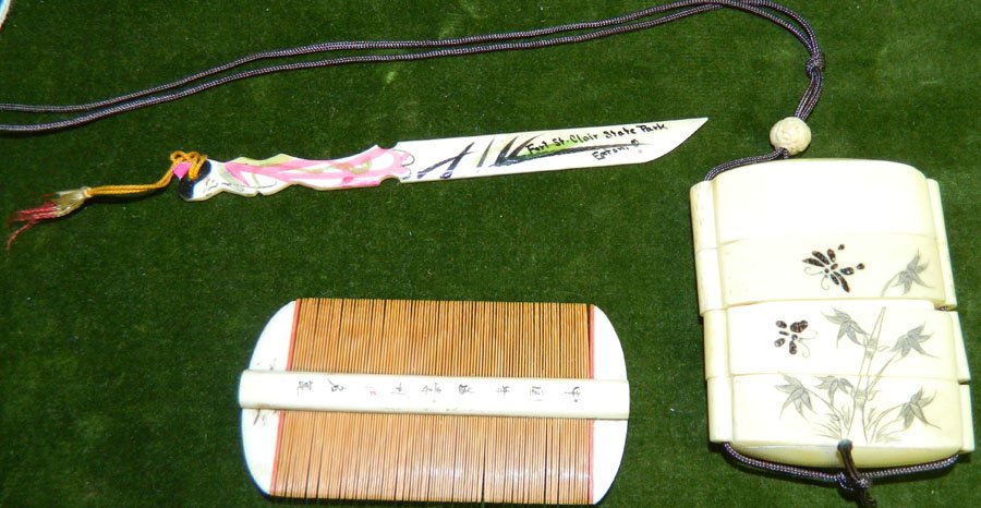 Ivory or bone comb, pill box and letter opener.: Ivory or bone comb, pill box and letter opener. Comb 3 1/2" long, pill box 2 3/4" x 2 1/4", letter opener 5 1/4" long.