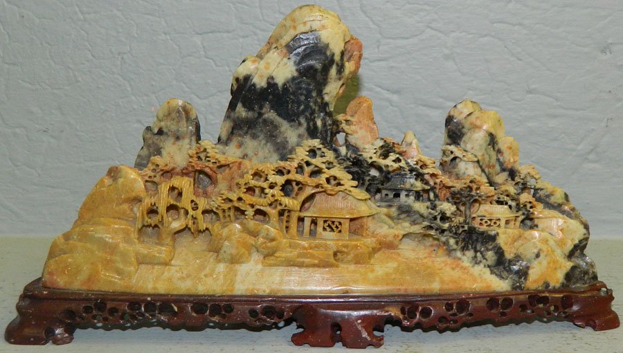 Soapstone figure of a Chinese village.: Soapstone figure of a Chinese village. 11" long x 6" tall.