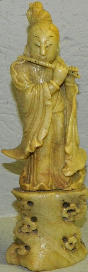Soapstone figure of Oriental lady playing a flute.: Soapstone figure of Oriental lady playing a flute. 9 3/4" tall.