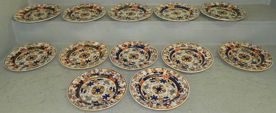 Set of 12 Ironstone decorated plates.: Set of 12 Ironstone decorated plates. 10" diameter.