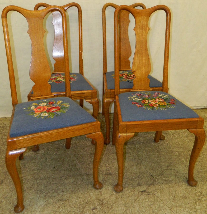 Set of four Queen Anne English oak chairs.: Set of four Queen Anne English oak chairs with needlepoint seats. 41 1/2" tall.