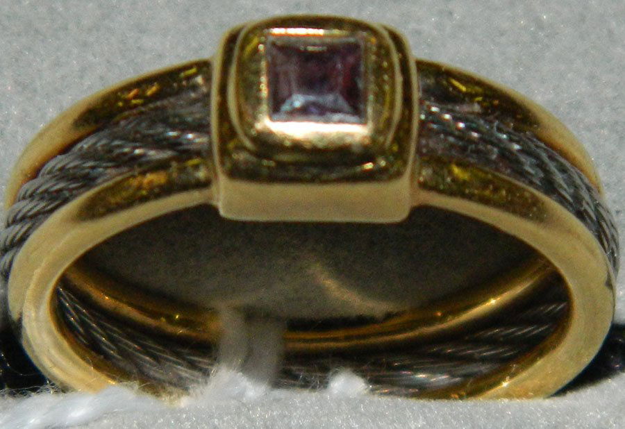 Dinner ring with black onyx, marked 750.: Dinner ring with black onyx, marked 750, .125 troy ounces with stones.