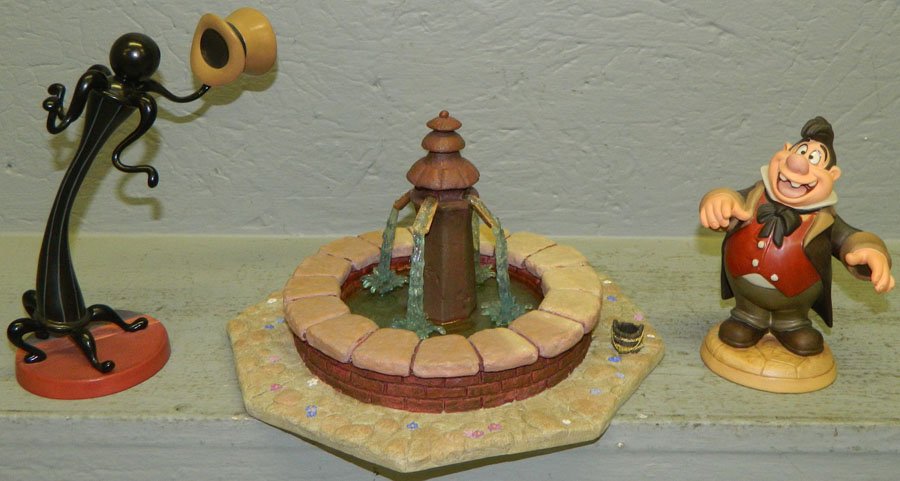 (3) Beauty and the Beast figurines.: Beauty and the Beast fountain centerpiece, "Hospitable Hat Rack", and "The Fool".