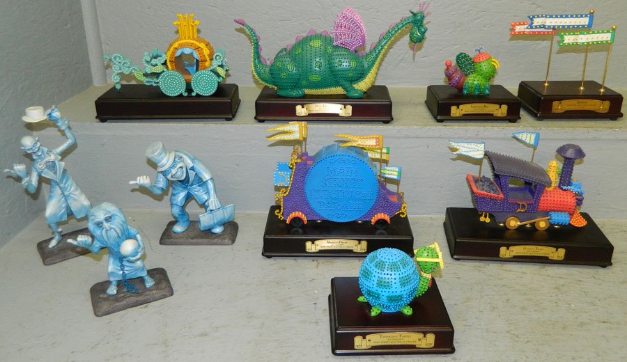 10 Main Street Electrical Figures.: Walt Disney collection of 10 Main Street Electrical Figures. Includes "Goofy's Train", "Twinkling Turtle", "Cinderella's Coach", (3) "Beware of Hitchhiking Ghost" (Ball and Chain Ghost, Derby Ghost, H