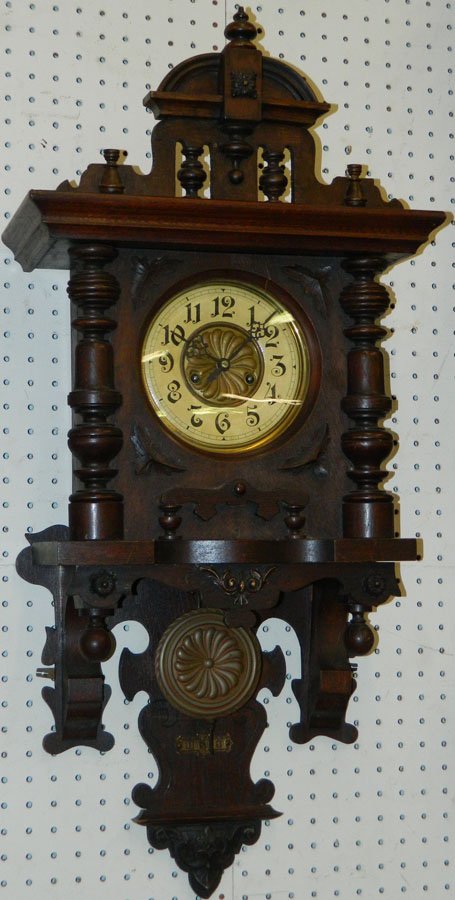 Gustav Becker oak hanging open pendulum clock.: Gustav Becker oak hanging open pendulum clock from a New Bern estate. 14 1/2" wide x 7" deep x 33" tall.