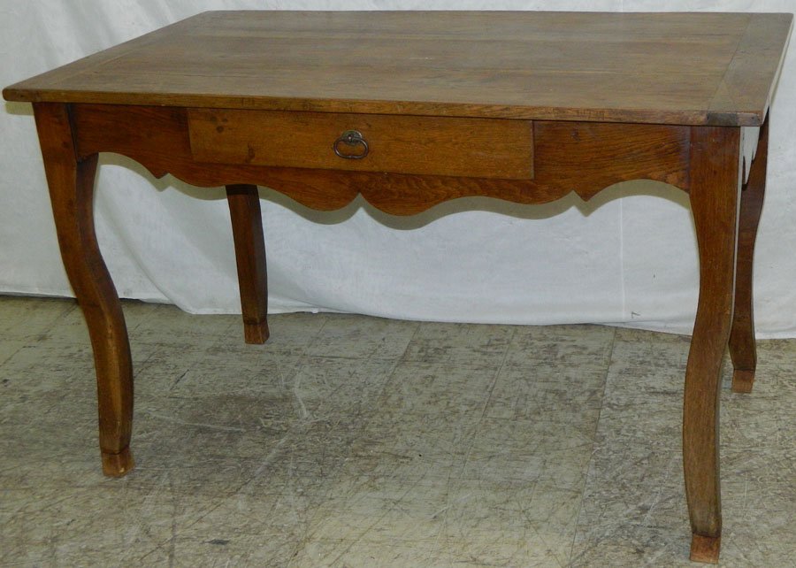 One drawer farm table with breadboard ends.: One drawer English oak farm table with breadboard ends. 28" wide x 48" long x 30" tall.