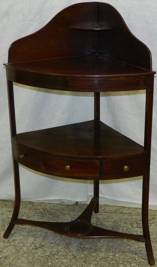 Mahogany Hepplewhite corner washstand.: Mahogany Hepplewhite corner washstand. 25" wide x 18" deep x 42" tall.