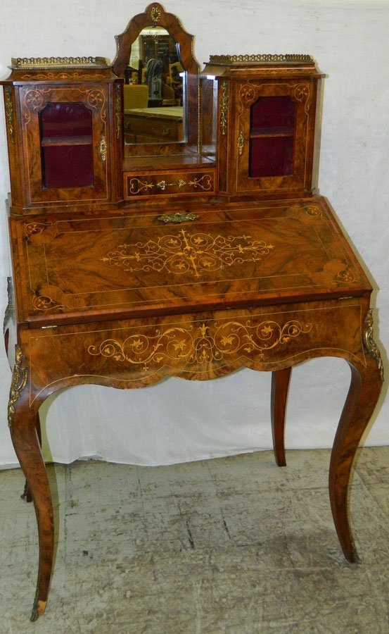 French inlaid lady's desk with cabriole legs.: French inlaid lady's desk with cabriole legs and brass ormolu mounts/decorations. 33" wide x 19 1/2" deep x 55" tall.