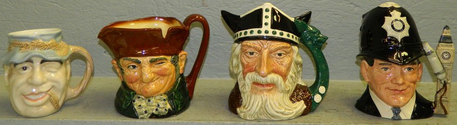 Four Royal Doulton toby mugs.: Four Royal Doulton toby mugs. Includes "London Bobby", "The Viking", "John Barleycorn", and "Old Charlie". 8" tall.