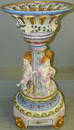 Dresden jardiniere with cupids on stand.