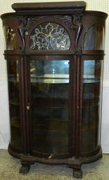 Oak china cabinet with beveled glass.