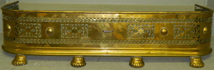 Open pierced brass fender. 44 1/2" long.: Open pierced brass fender. 44 1/2" long.