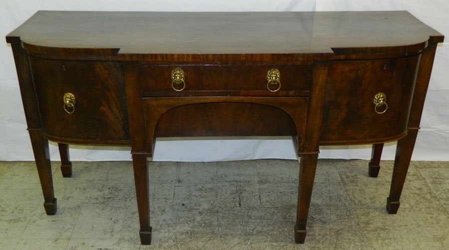 19th C Sheraton sideboard.: 19th Century Sheraton sideboard with two cellarette drawers. 70" wide x 24" deep x 36" tall.