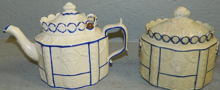 19 C Eng Staffordshire teapot & covered sugar.: 19th Century English Staffordshire teapot and covered sugar dish with American seal. Teapot has staple repair. Both 6" tall.