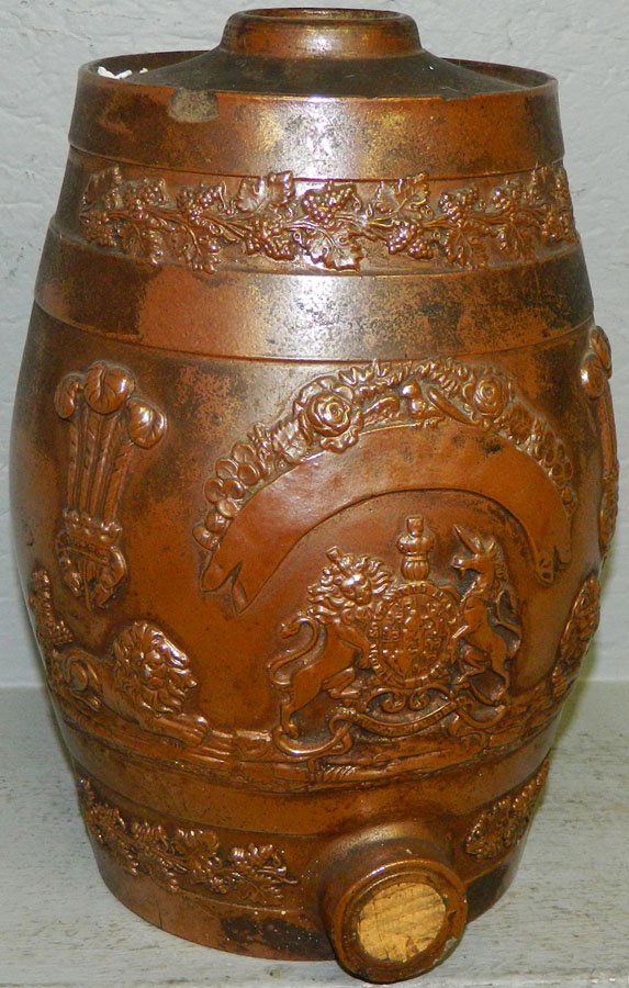 Early redware pottery keg with British seal.: Early redware pottery keg with British seal. Chipped on top. 11" tall.