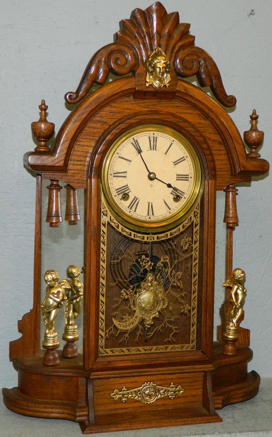 Gilbert oak mirror side kitchen clock.: Gilbert oak mirror side kitchen clock. 16" wide x 5 1/2" deep x 24" tall.
