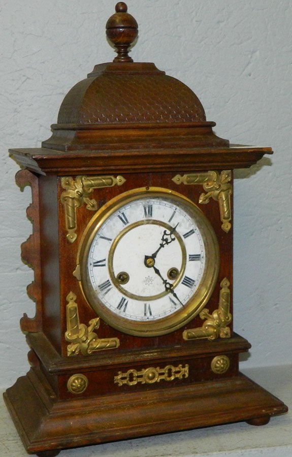 German bracket clock with porcelain dial.: German bracket clock with porcelain dial by Jerome. 11" wide x 6 1/2" deep x 18" tall.
