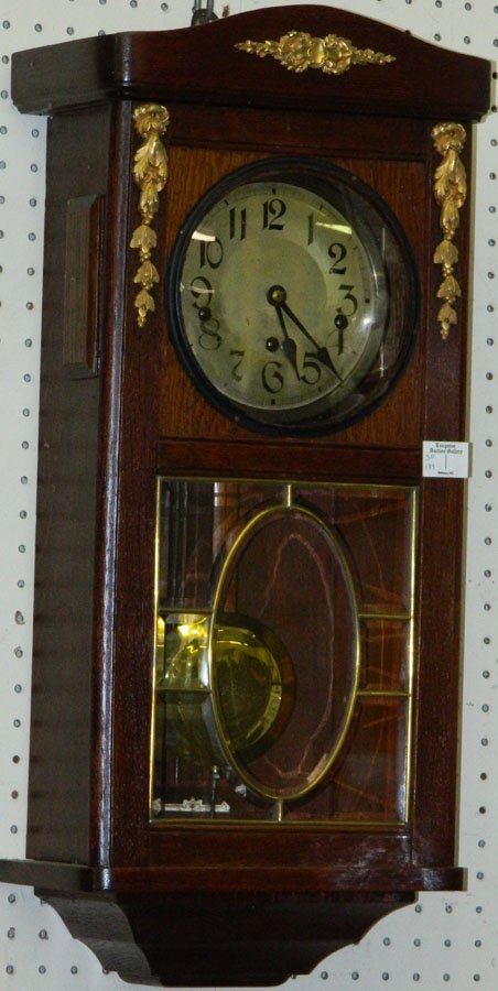 German box wall clock w/beveled glass & ormolu.: German box wall clock with beveled glass and ormolu. 27" long.