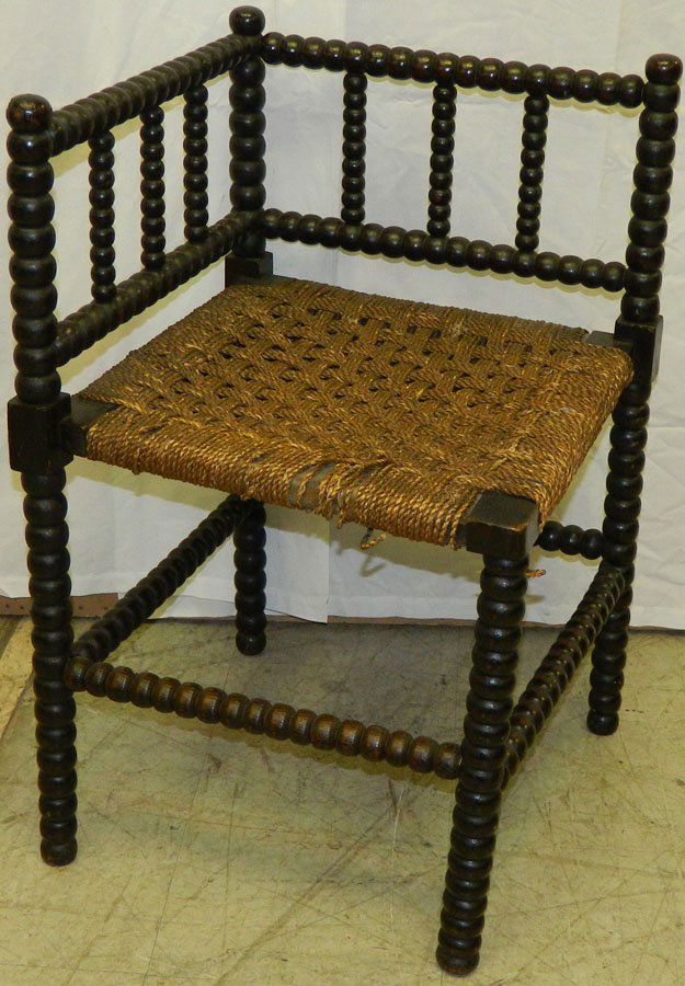 Bobbin turned corner chair with rush seat.: Bobbin turned corner chair with rush seat. 15" wide x 25 1/2" tall.