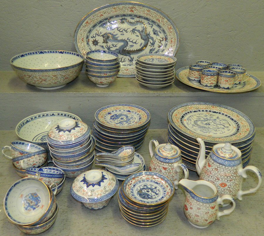 (79) Pcs of Rice pattern dragon decorated china.: (79) Pieces of Rice pattern dragon decorated china. Dinner plates 10" diameter, charger 12" diameter, Platter 16" long.