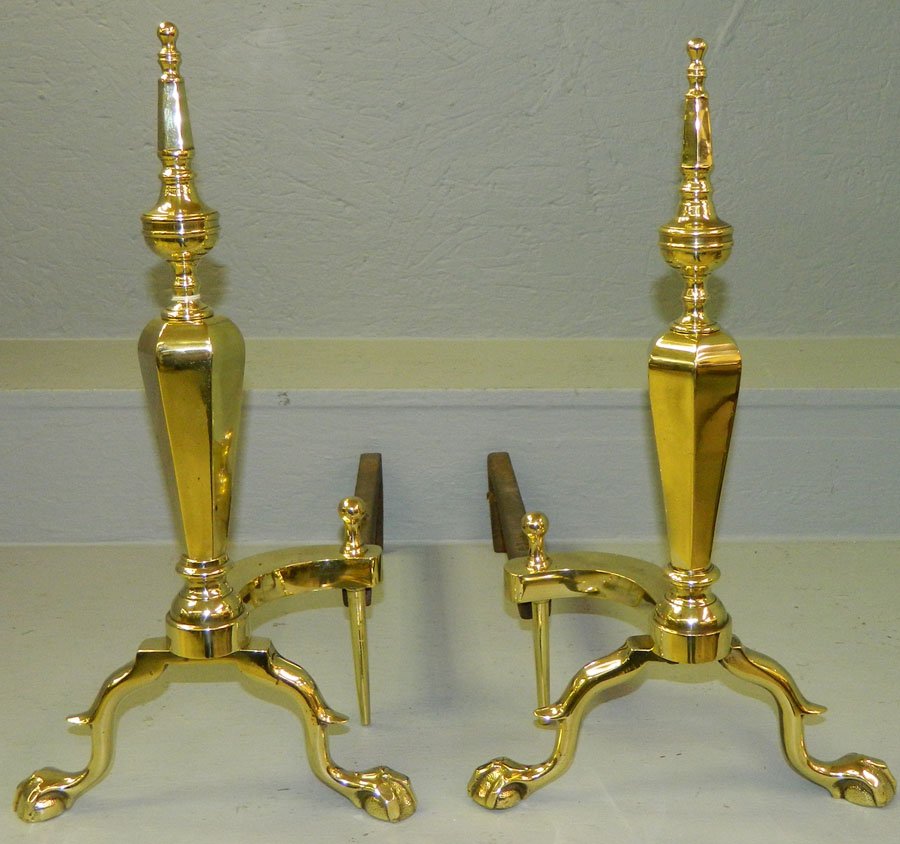 Pair of claw foot brass andirons.: Pair of claw foot brass andirons. 18 1/2" tall.