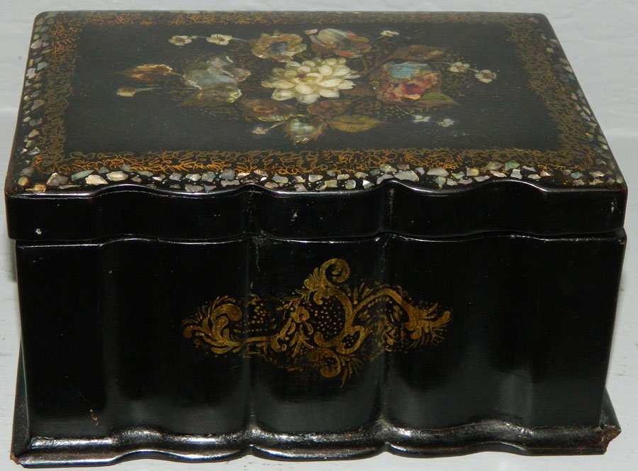 Papier mache and mother of pearl inlaid box.: Papier mache and mother of pearl inlaid box. 7" wide x 4 1/2" deep x 4" tall.