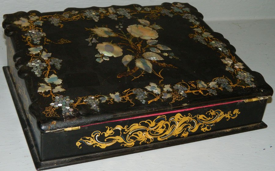 Papier mache and mother of pearl inlaid lap desk.: Papier mache and mother of pearl inlaid lap desk. 12" wide x 9 1/2" deep x 4" tall.