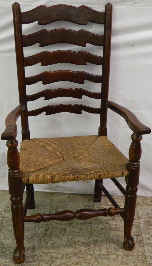 18th C QA ladder back arm chair w/rush seat.: 18th Century Queen Anne ladder back arm chair with rush seat. 40" back.