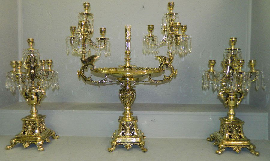 Three piece brass garniture set.: Three piece brass garniture set. (2) 8" x 22" tall, large 26" x 29" tall.