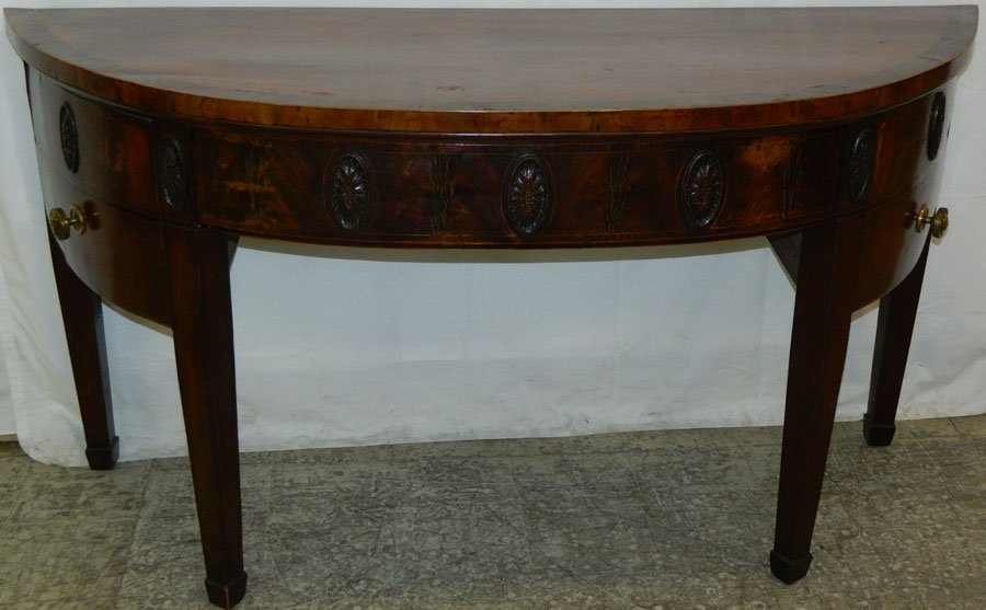 Mahogany bowfront Hepplewhite sideboard.: Mahogany bowfront Hepplewhite sideboard with Adam's style carving. Left hand side has a secret lock door. 66" wide x 24 1/2" deep x 34 3/4" tall.