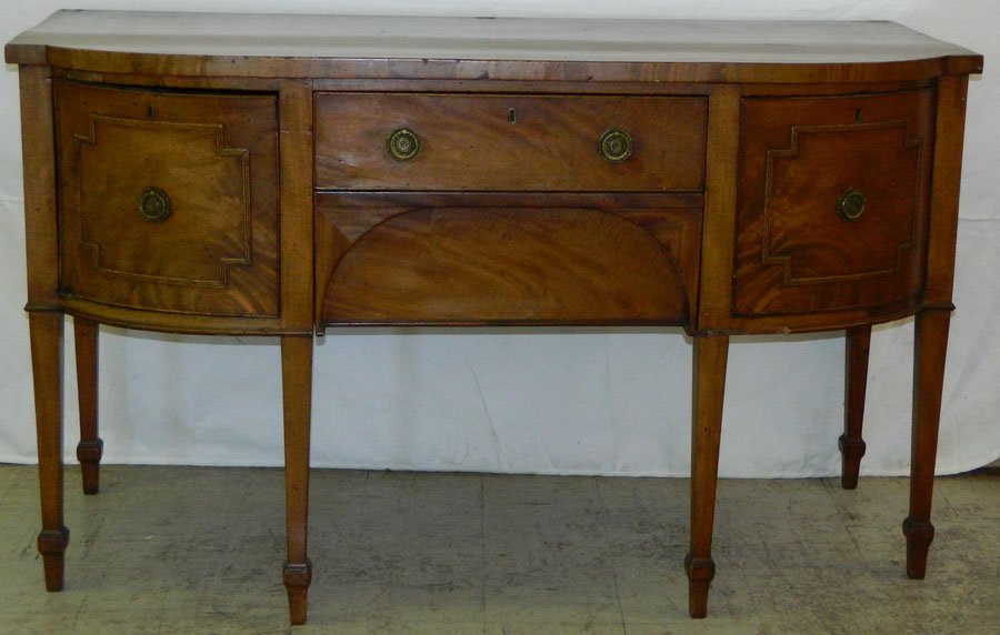 Mahogany bow front sideboard w/ one cellarette dr: Mahogany bow front sideboard w/ one cellarette drawer c.1830. 62" w x 26 1/2" x 36 3/4".